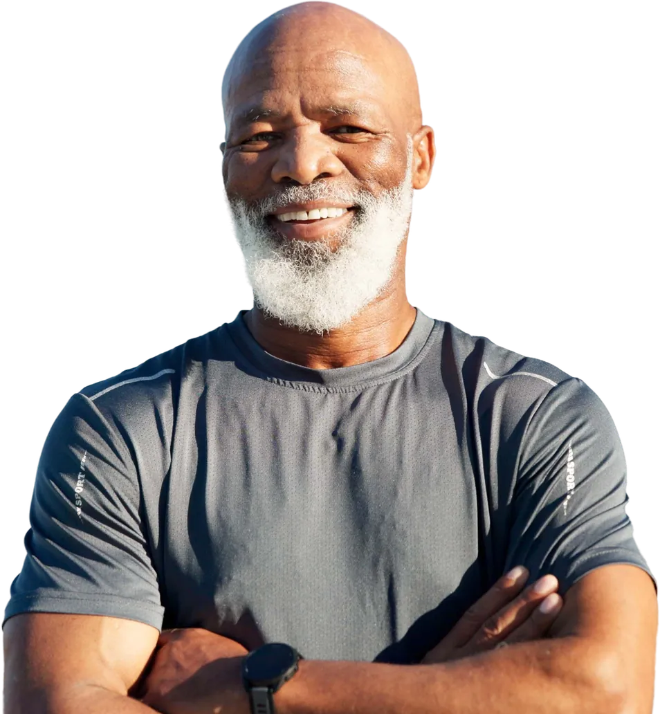 Smiling older man with a white beard and crossed arms
