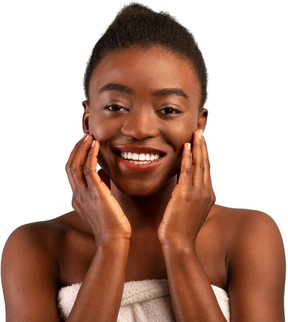 Smiling woman in a towel touching her cheeks