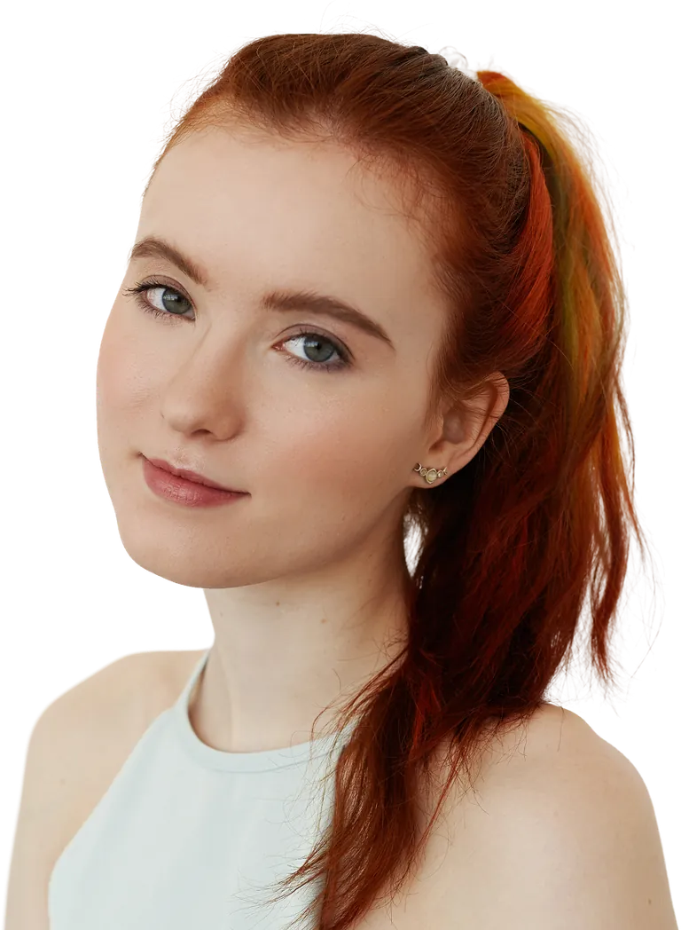 Young woman with red hair smiling softly