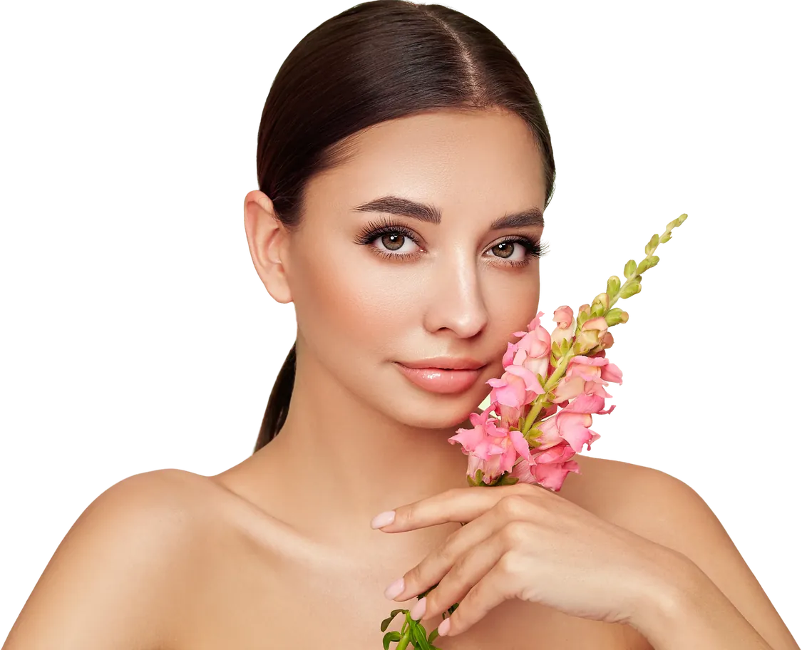 Woman with radiant skin holding pink flowers