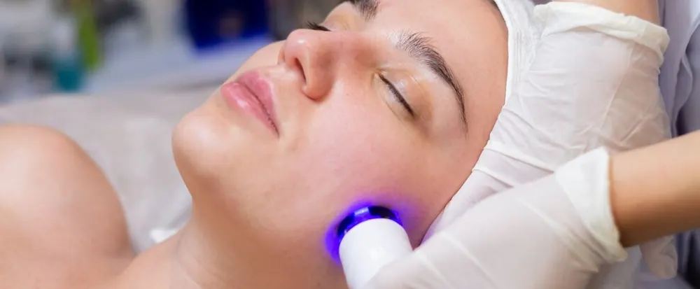 CoolJet cold plasma device being used on a client's jawline