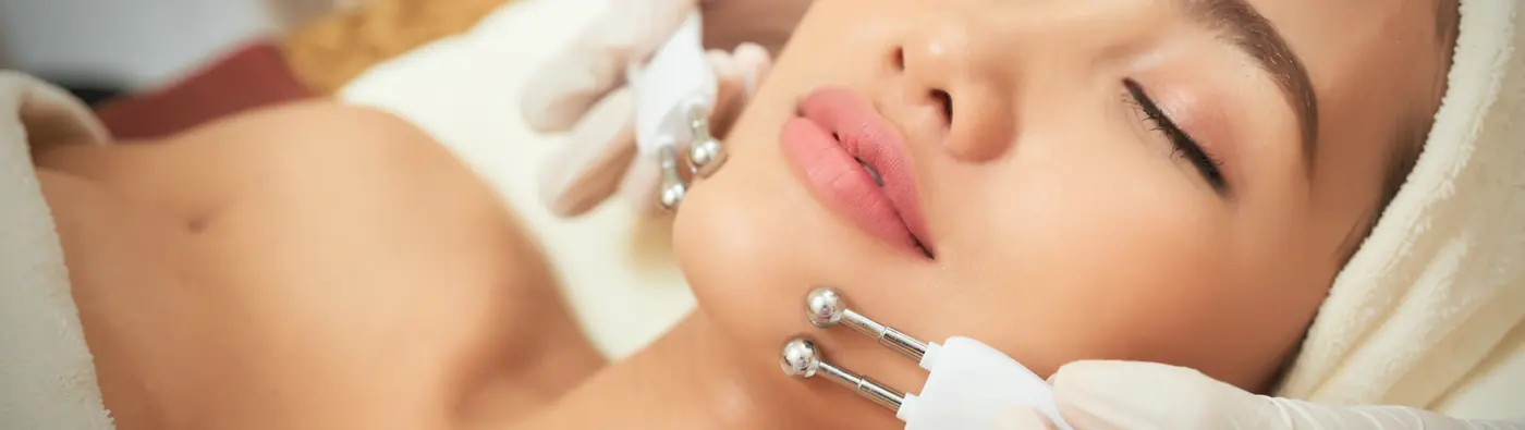 Microcurrent probes being used along a client's jawline