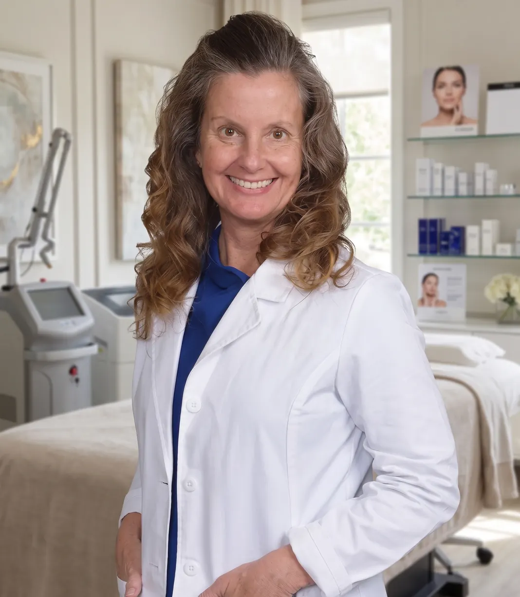 Melody McClain, MSN, APRN, FNP-C, in a white coat